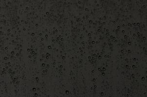 Focus and blurred photo of Rain drop on glass window with dark color for abstract and background concept.