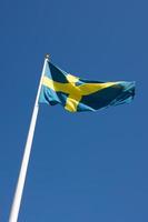 Swedish flag blowing in the wind photo