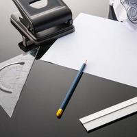 Office supplies on black table photo