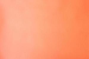 Peach pink paper background, blank color backdrop photo