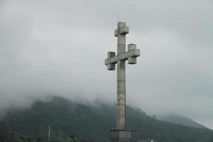 Stone medival cross on the mountain, Gergio Batumi photo