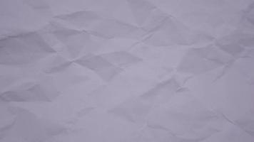 Crumpled wrinkled sheet of paper background texture. Stop motion animation. Seamless looping. video