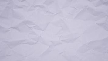 Crumpled wrinkled sheet of paper background texture. Stop motion animation. Seamless looping. video