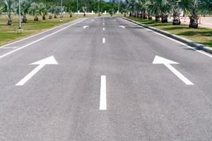 asphalt road with white arrow photo