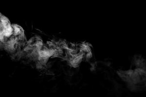 Abstract powder or smoke effect isolated on black background photo