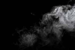 Abstract powder or smoke effect isolated on black background photo