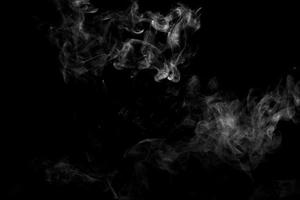 Abstract powder or smoke effect isolated on black background photo