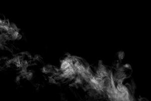 Abstract powder or smoke effect isolated on black background photo