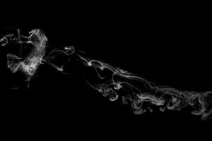 Abstract powder or smoke effect isolated on black background photo