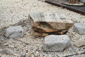 stone table set in garden photo