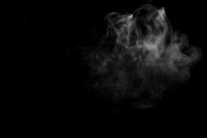 Abstract powder or smoke effect isolated on black background photo