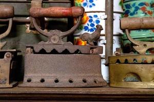 Closeup antique iron with wooden handle photo