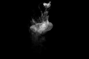 Abstract powder or smoke effect isolated on black background photo