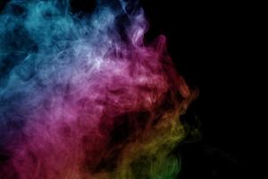 Abstract smoke isolated on black background,Rainbow powder photo