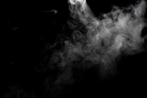 Abstract powder or smoke effect isolated on black background photo