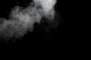 Abstract powder or smoke effect isolated on black background photo