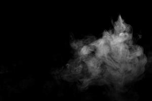 Abstract powder or smoke effect isolated on black background photo