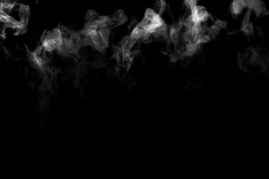 Abstract powder or smoke effect isolated on black background photo