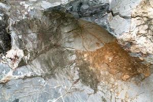 Closeup rock pattern with hole in nature photo