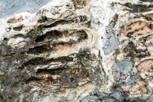 Closeup rock pattern with hole in nature photo