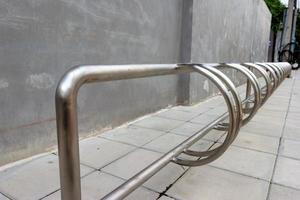 Parking lot is empty for bicycle with wall background photo