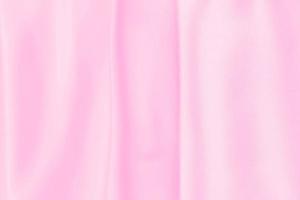 Plastic pink satin fabric texture soft blur background photo