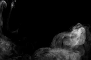 Abstract powder or smoke effect isolated on black background photo