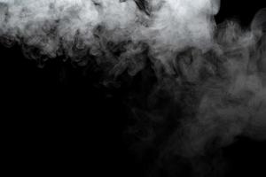 Abstract powder or smoke effect isolated on black background photo