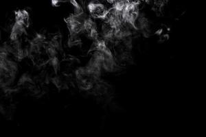 Abstract powder or smoke effect isolated on black background photo