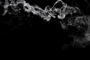 Abstract powder or smoke effect isolated on black background photo