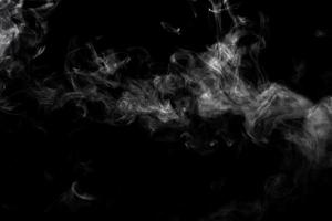 Abstract powder or smoke effect isolated on black background photo