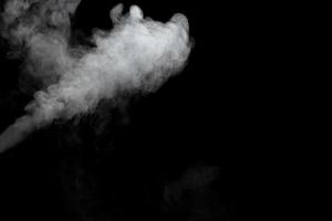 Abstract powder or smoke effect isolated on black background photo