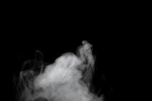 Abstract powder or smoke effect isolated on black background photo