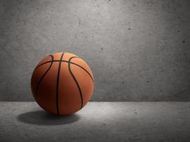 Basketball on cement wall background photo