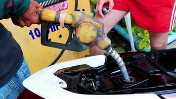 Koh Samui Surat Thani Thailand 2018 Fill fuel tank of a scooter motorcycle Koh Samui Thailand. video