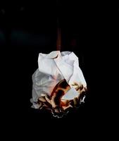 burning paper dark background photo