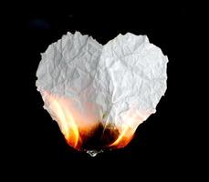 burning paper dark background photo