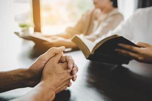 Group of people praying worship believe photo