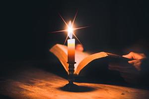 Woman hands praying with holy bible photo