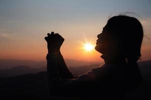 woman worship on sunset photo