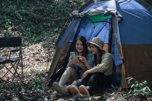 camping tent camp in nature happy friends photo