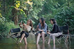 group of Asian girls enjoying a day at the  during holiday camping photo