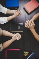 Group of people praying worship believe photo