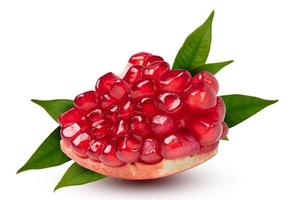 Ripe pomegranate Piece with leaves on the white background. with clipping path. photo