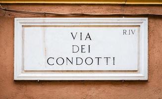 Rome, Italy. Street plate of the famous Condotti Road - Via dei Condotti - center of the Roman luxury shopping. photo