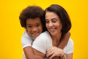 White mother with black son. Adoption Concept. Social respect, skin color, inclusion. photo