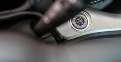 Car engine start button close-up. photo