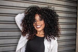 Beauty portrait of african american woman with afro hairstyle on street photo