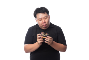 joven asiático gordo divertido con donuts, archivo png