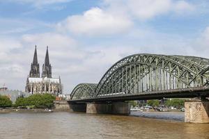 Hohenzollern Bridge and Cologne Cathedral in Cologne, Germany photo